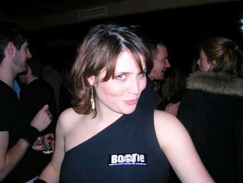 Colleen wears a Bootie sticker